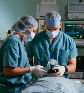 doctors operating on a patient in an operating room